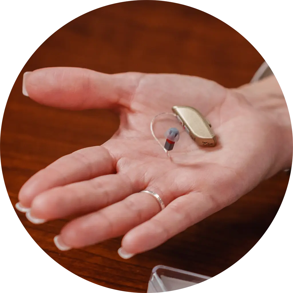 Hearing aid in hand - Hearing aids and accessories