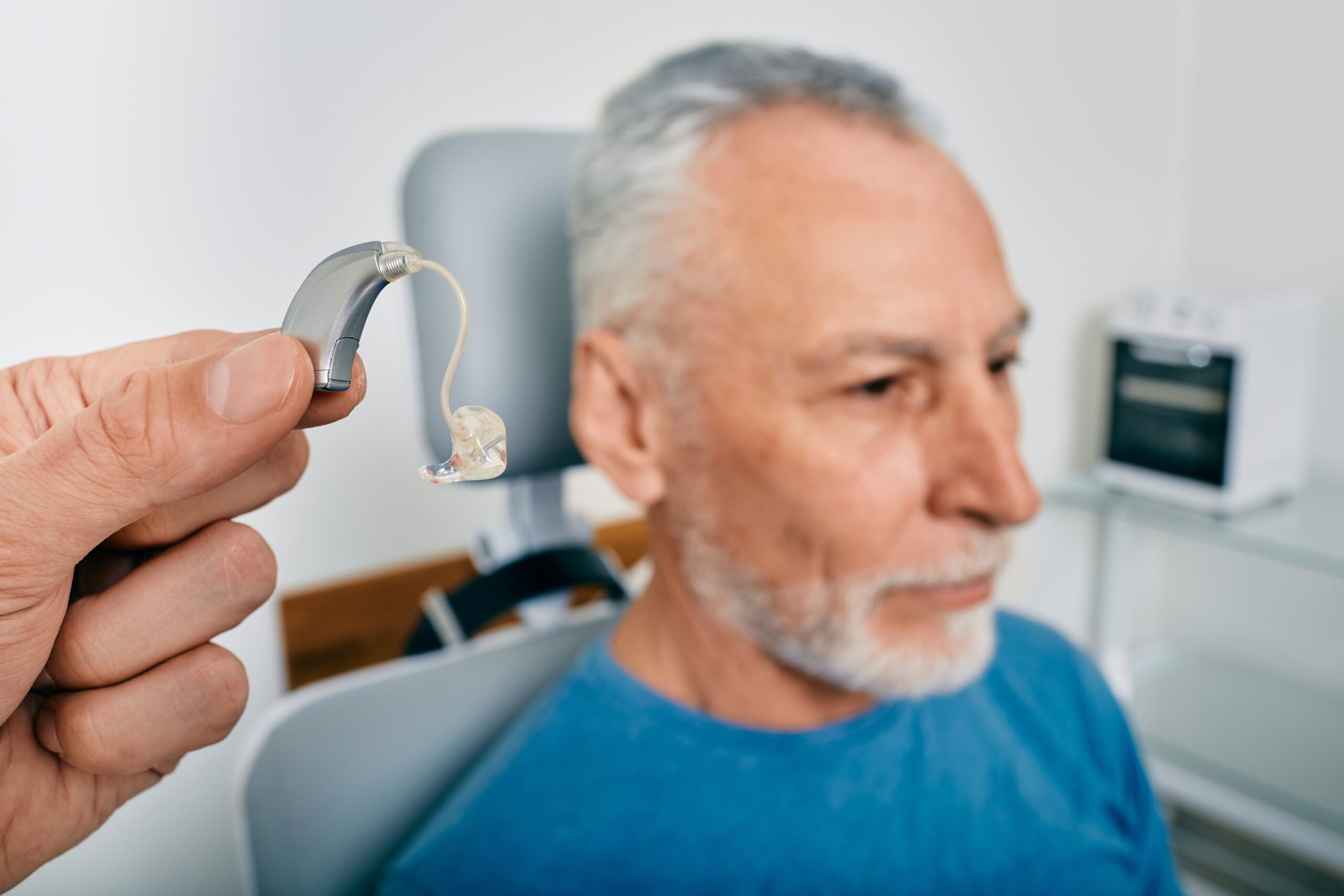presenting hearing aid to patient