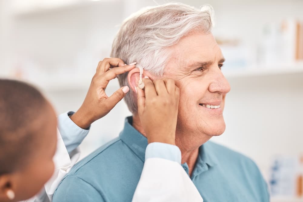 man-and-doctor-with-hearing-aid