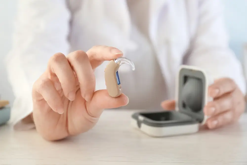  doctor holding hearing aid