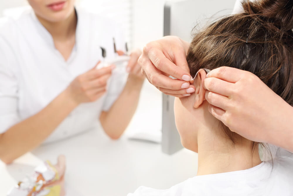  woman getting hearing aids