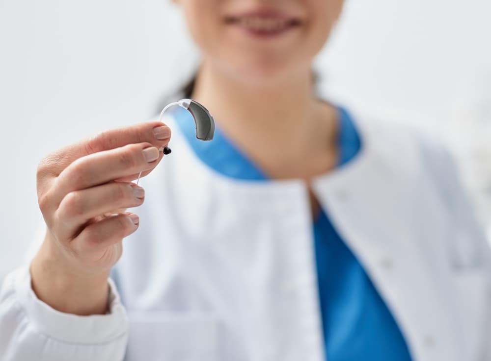 hand holding a hearing aid