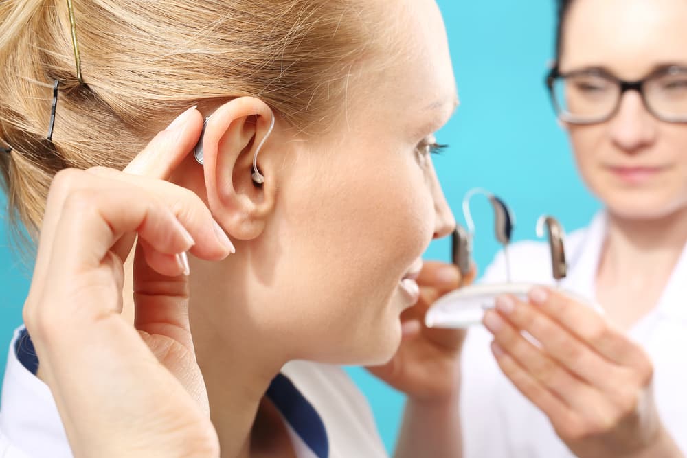 patient getting hearing aids